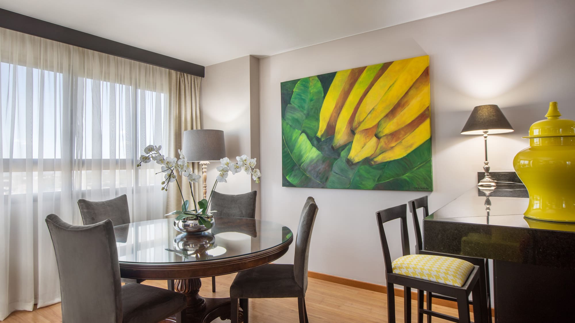 a dining room with a table and chairs