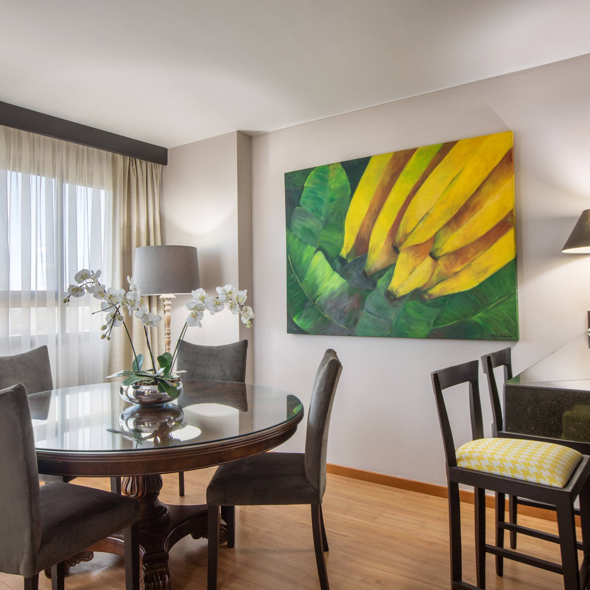 a dining room with a table and chairs