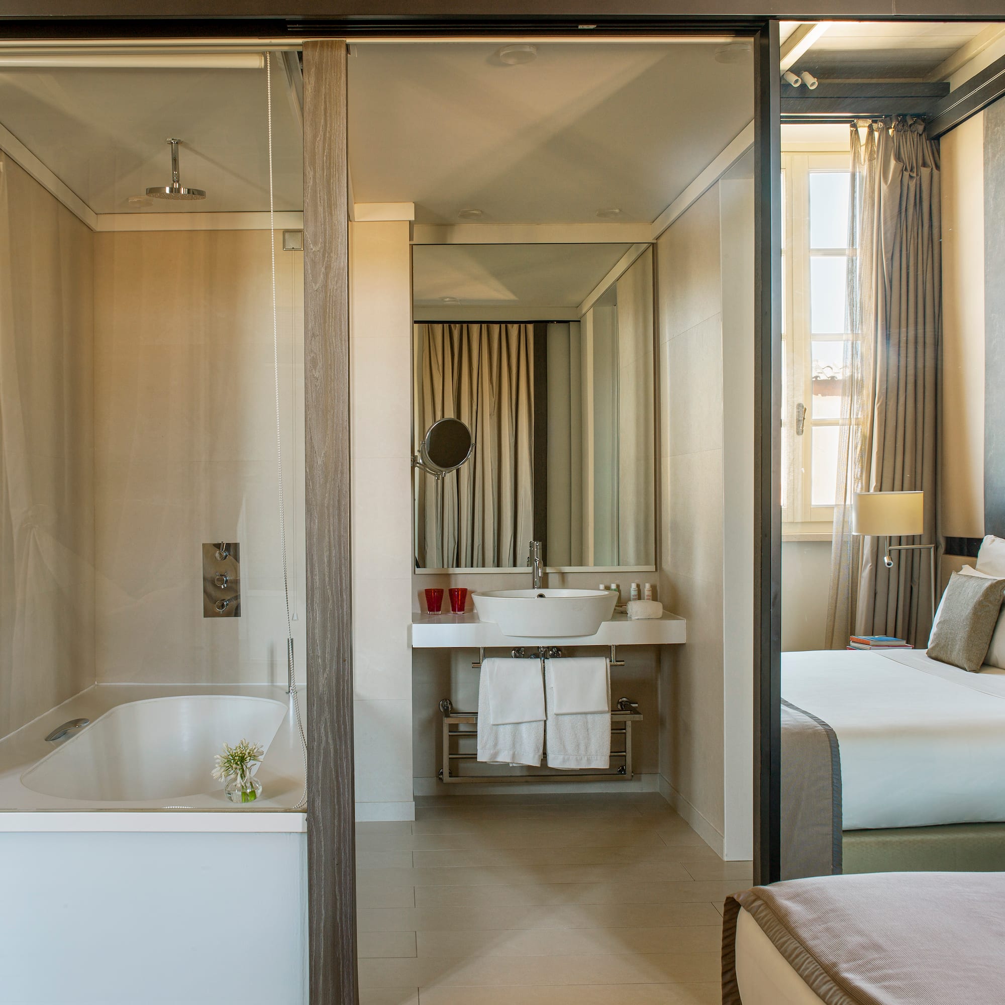 a bathroom with a bathtub and a mirror