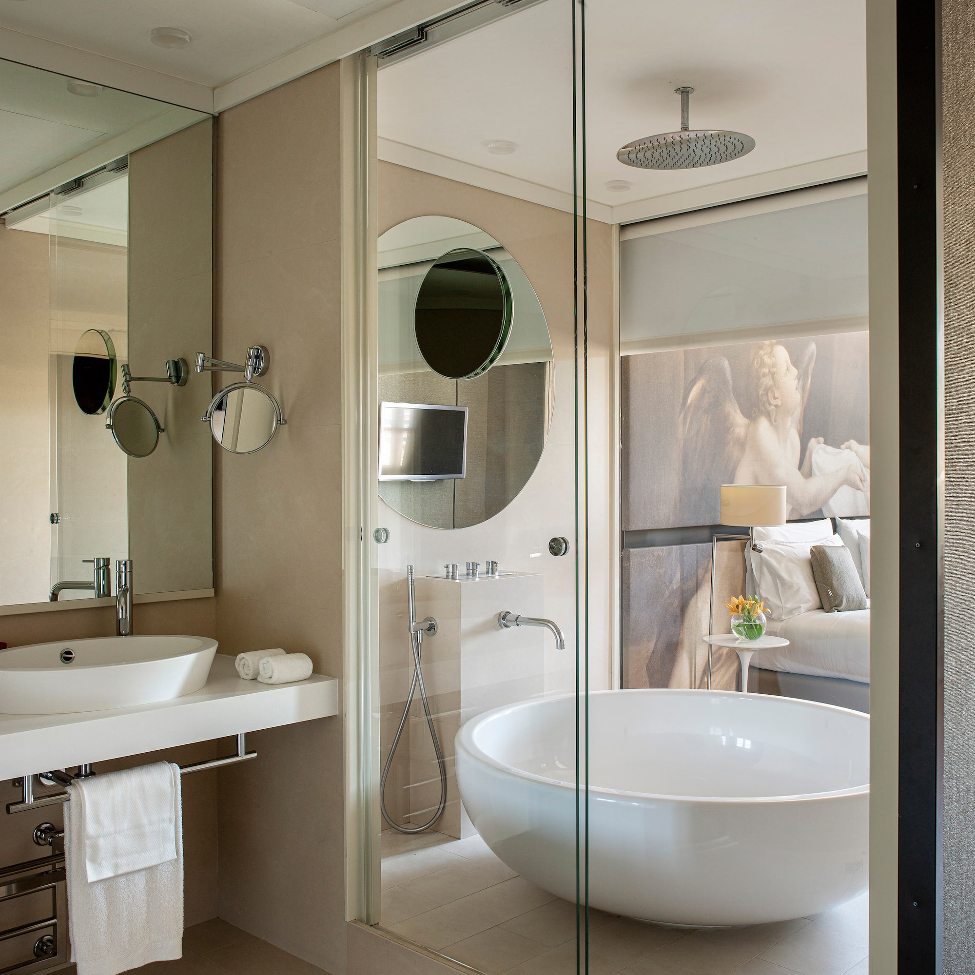 a bathroom with a large tub and a shower
