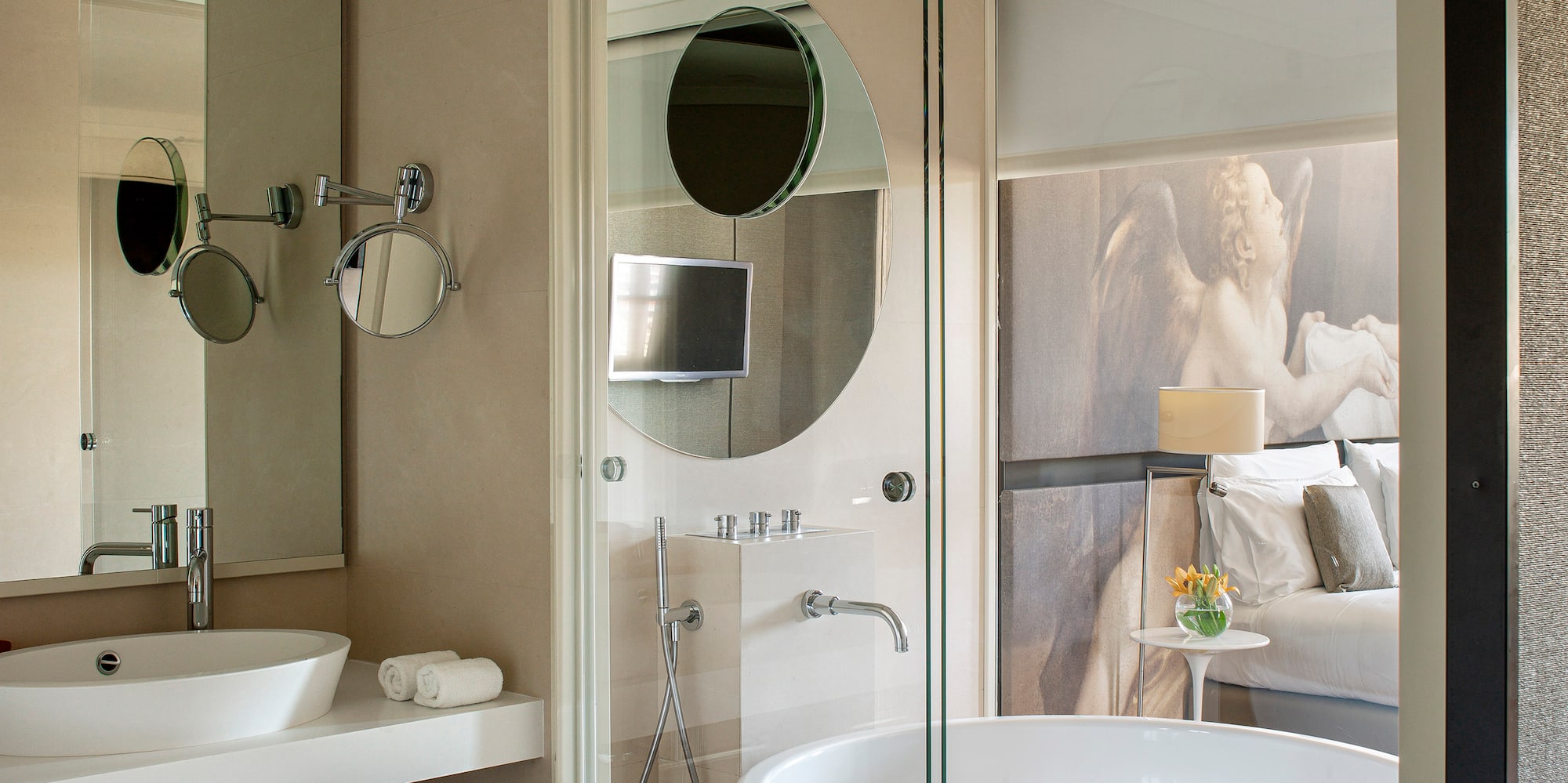 a bathroom with a large tub and a shower