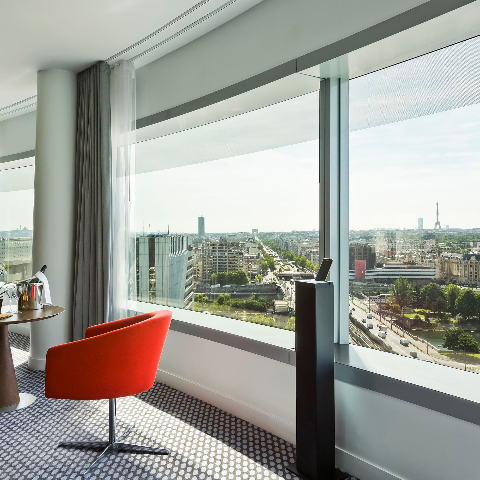 a room with a table and chairs and a window
