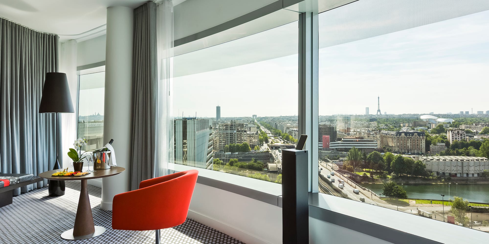a room with a table and chairs and a window