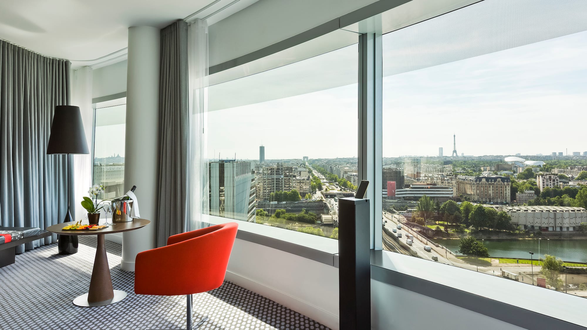 a room with a table and chairs and a window