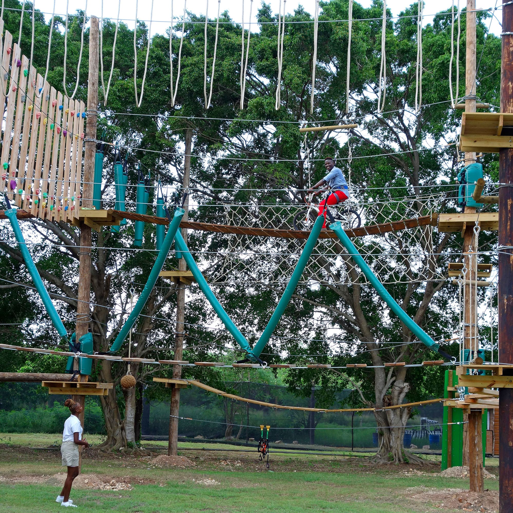 a person on a rope bridge