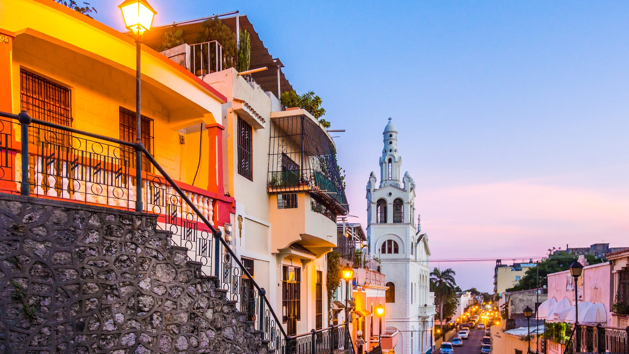 a street with buildings and a church