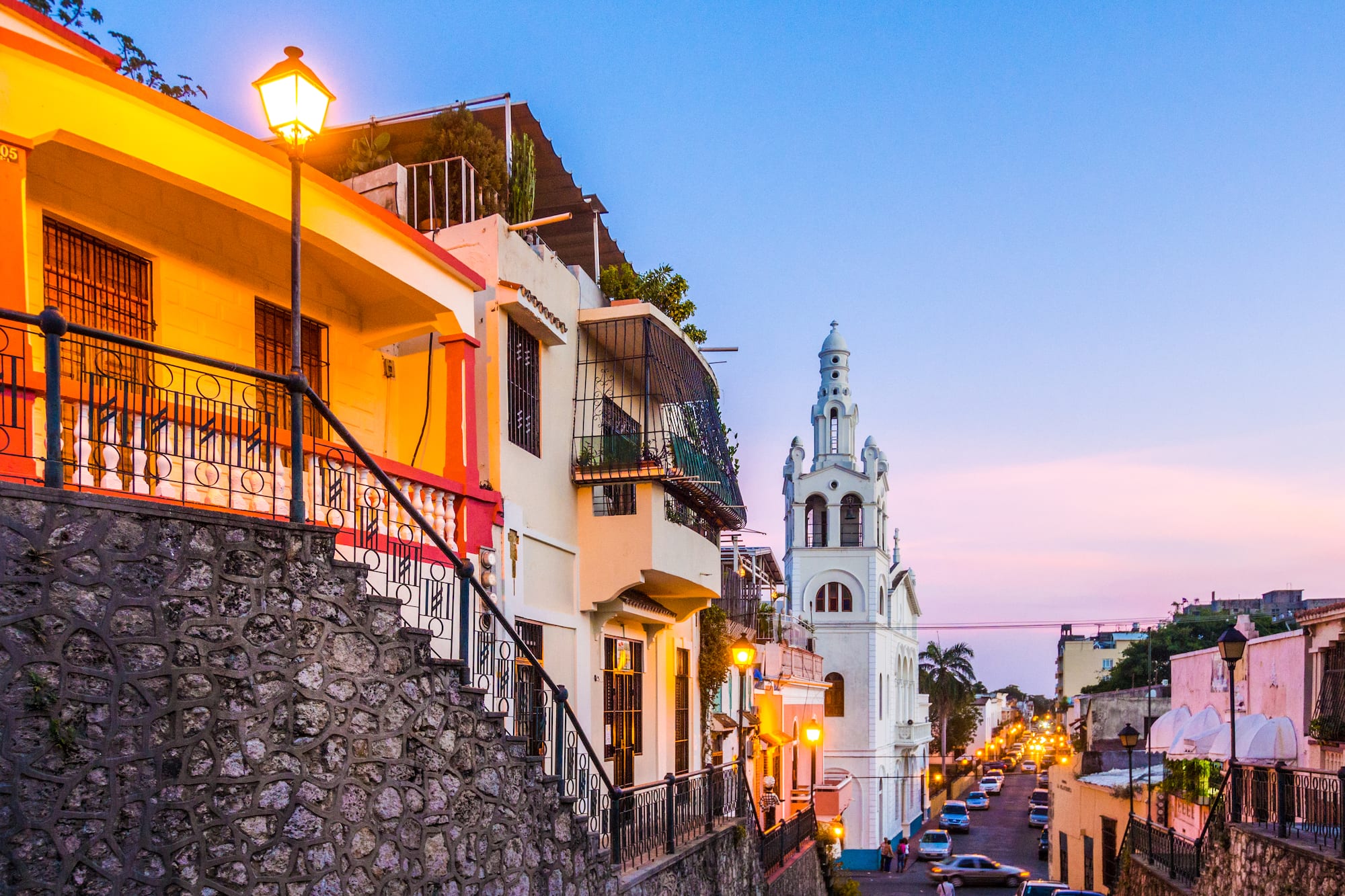 a street with buildings and a church