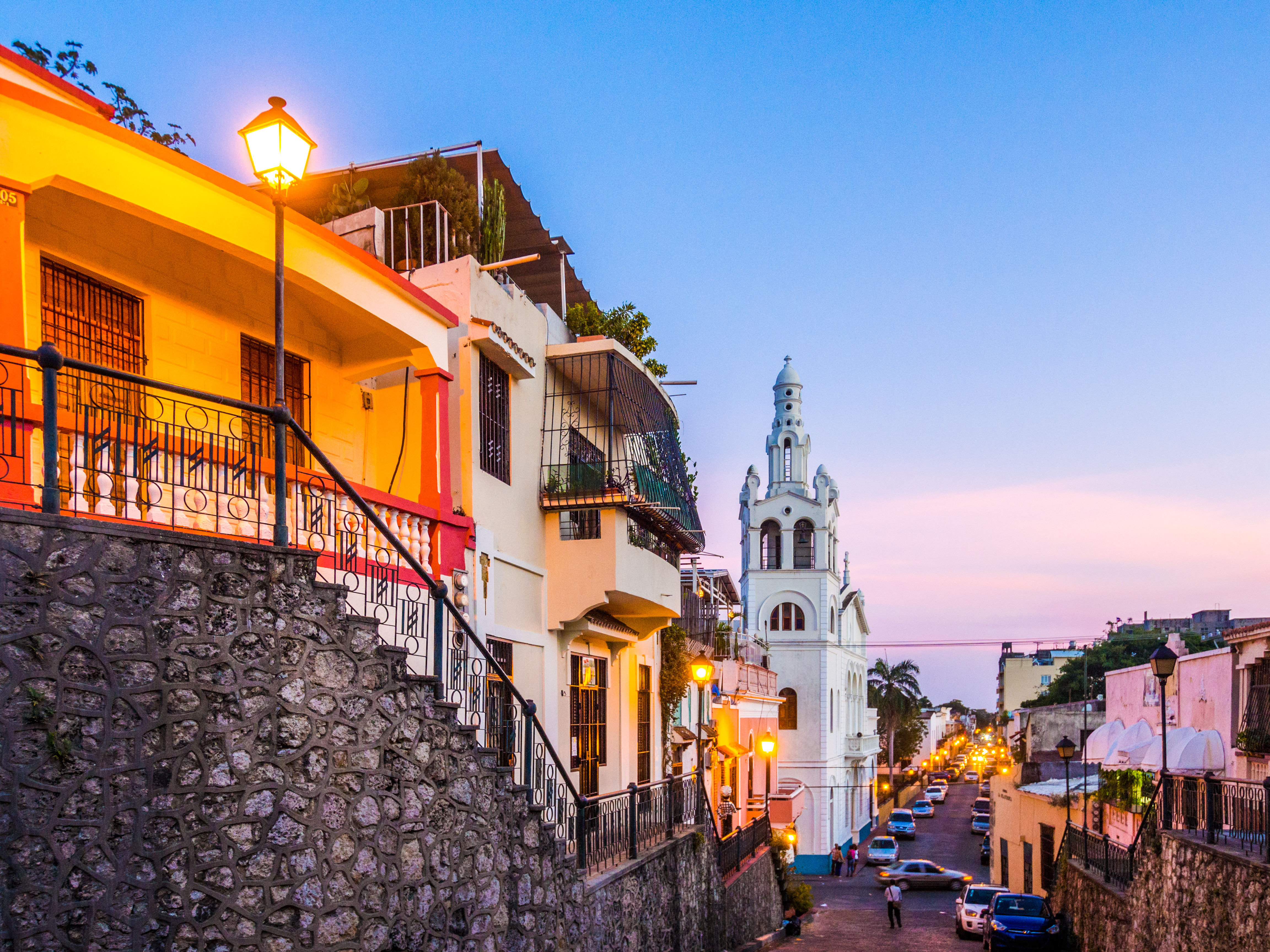 a street with buildings and a church