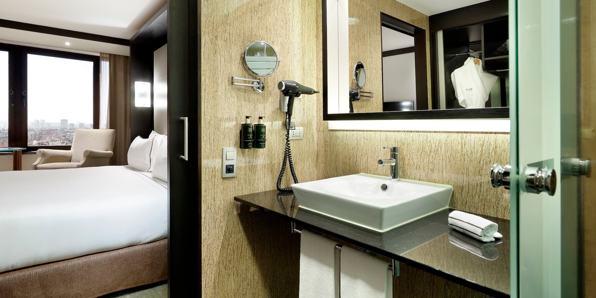 a bathroom with a mirror and a sink