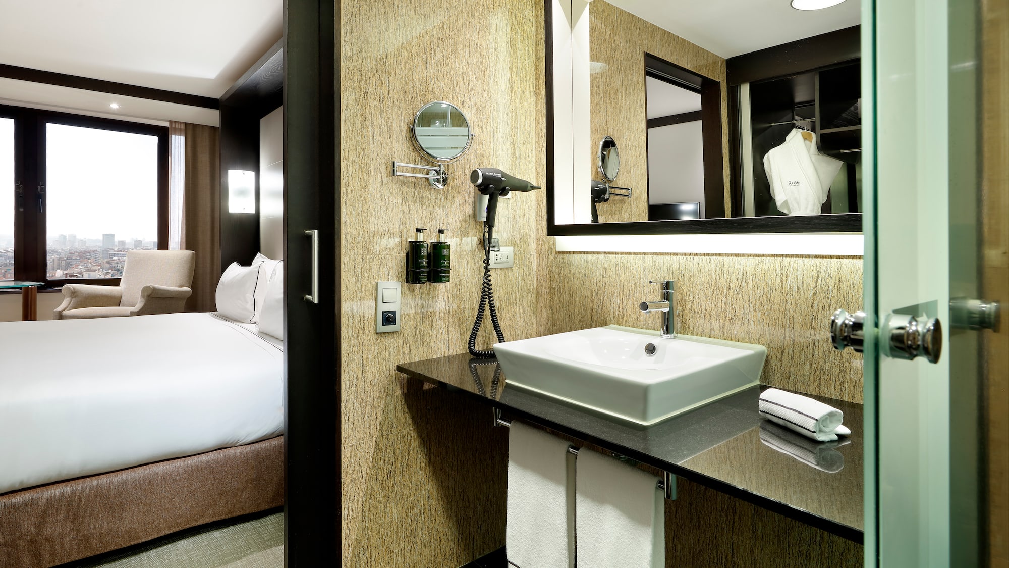 a bathroom with a mirror and a sink