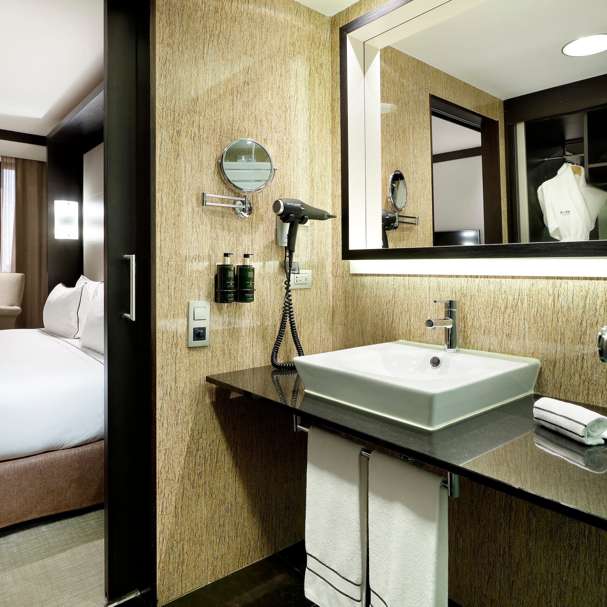 a bathroom with a mirror and a sink