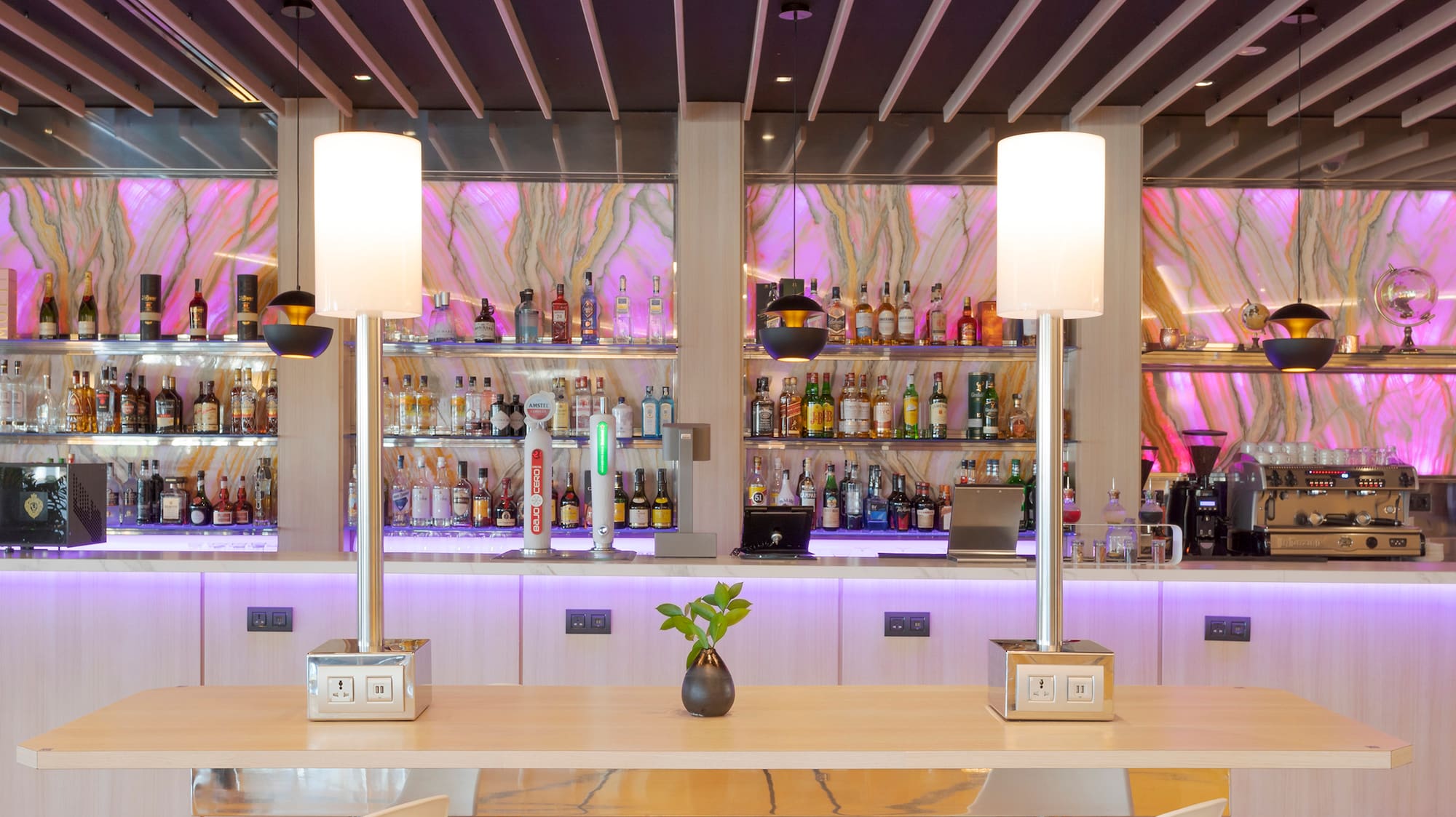 a bar with a table and chairs