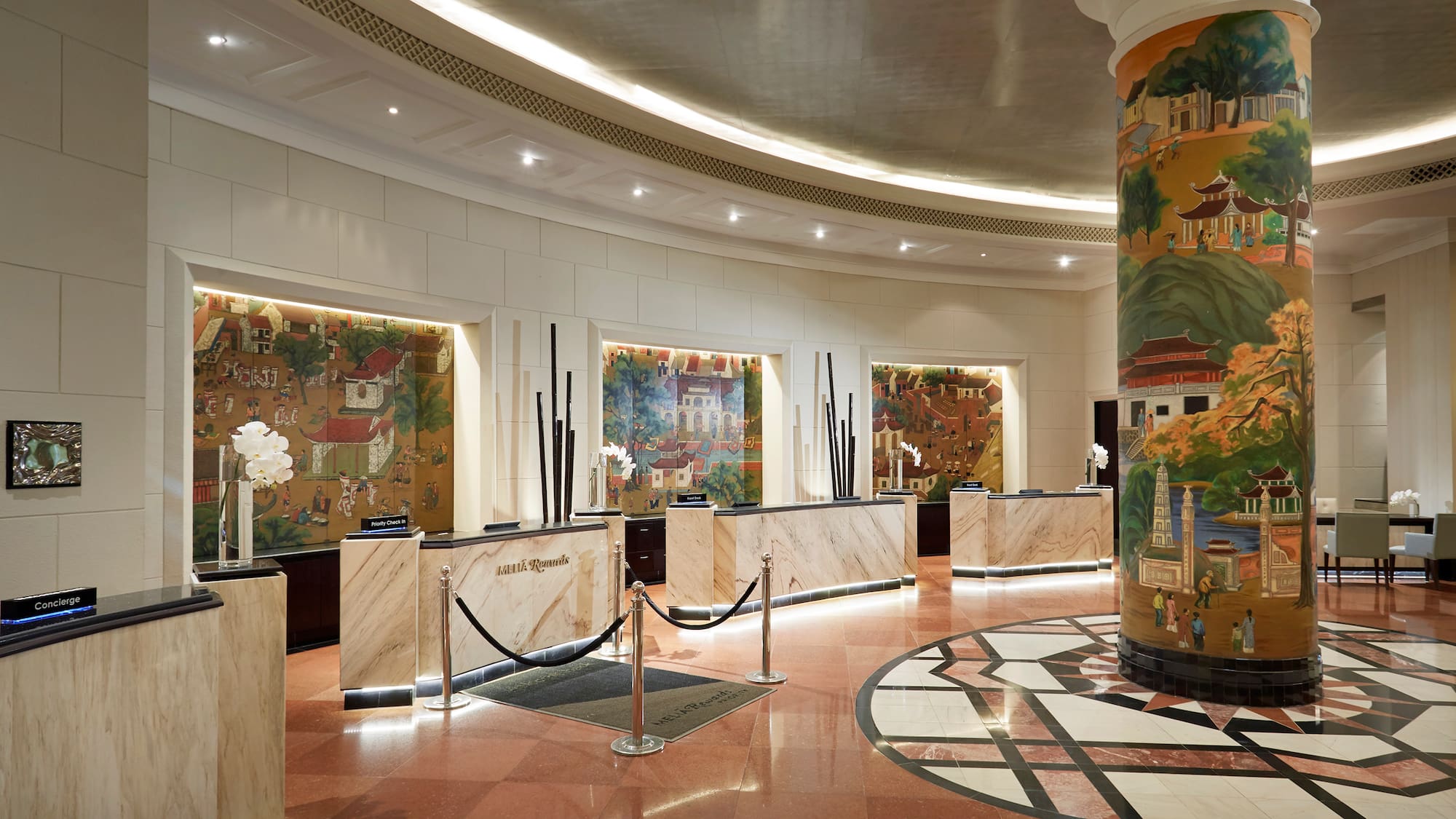 a lobby with a marble counter and a marble floor