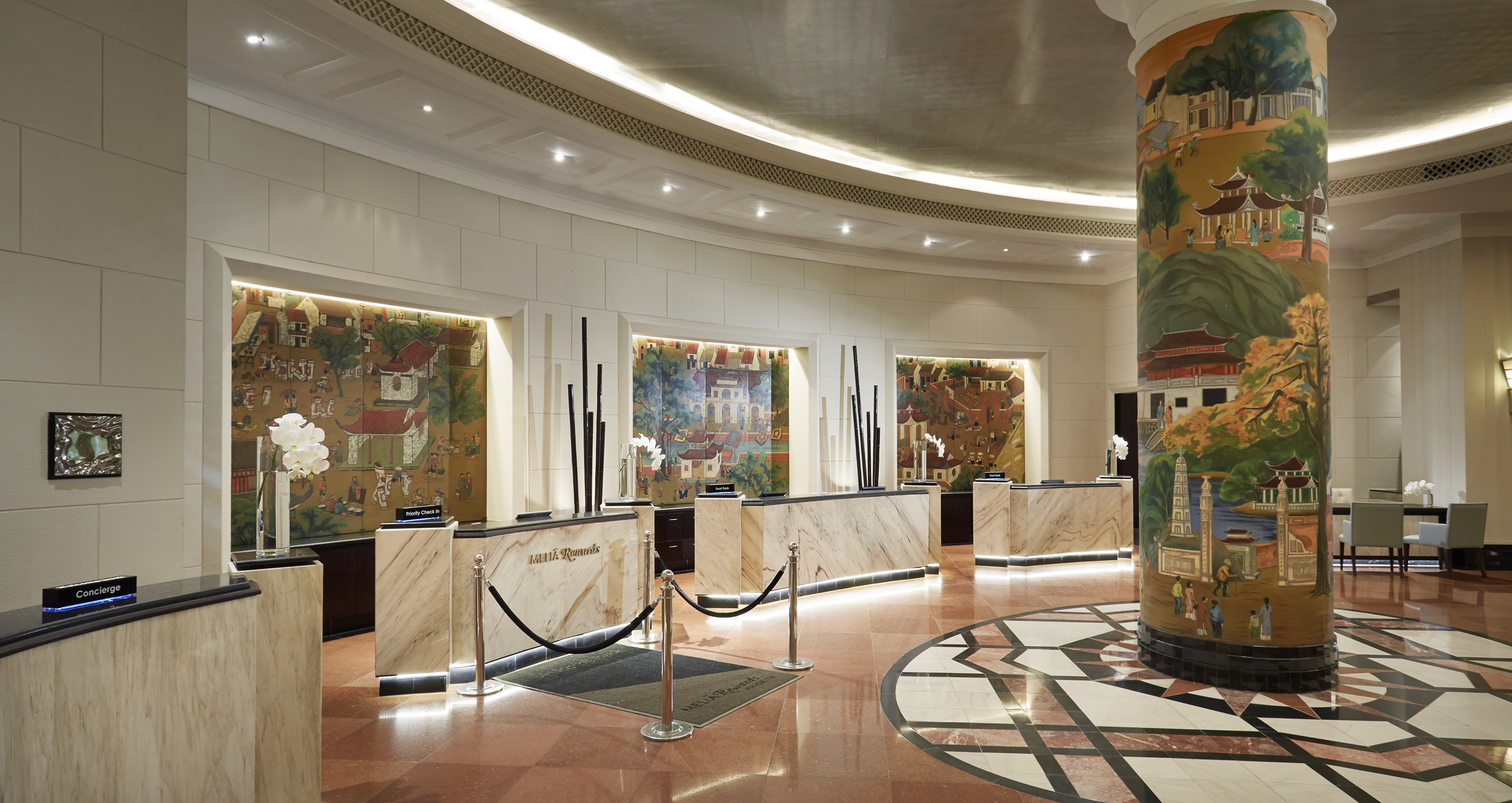 a lobby with a marble counter and a marble floor