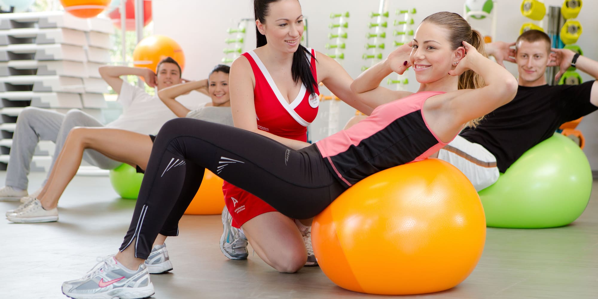 a group of people exercising on a ball