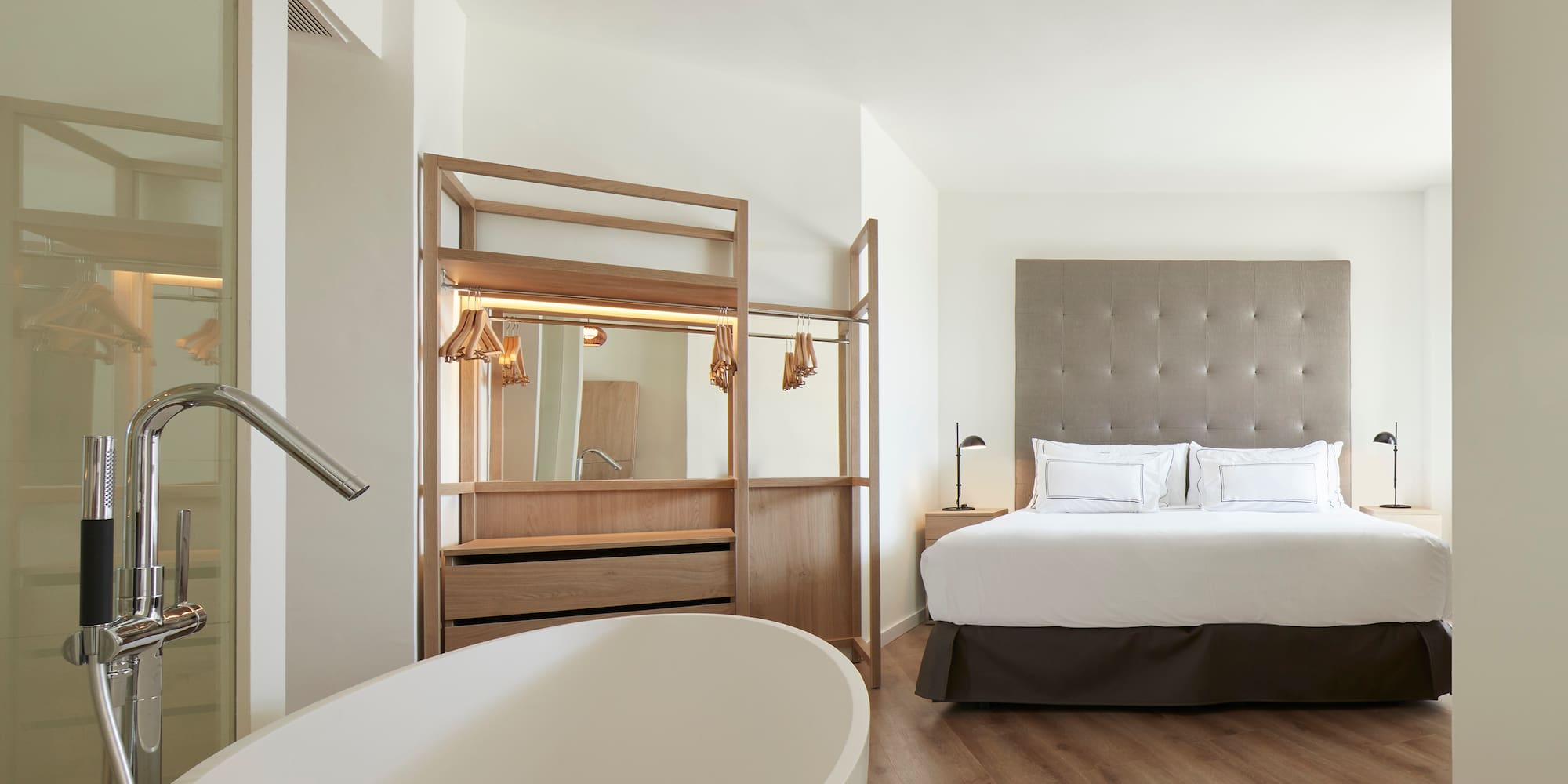 a room with a bed and a bathtub