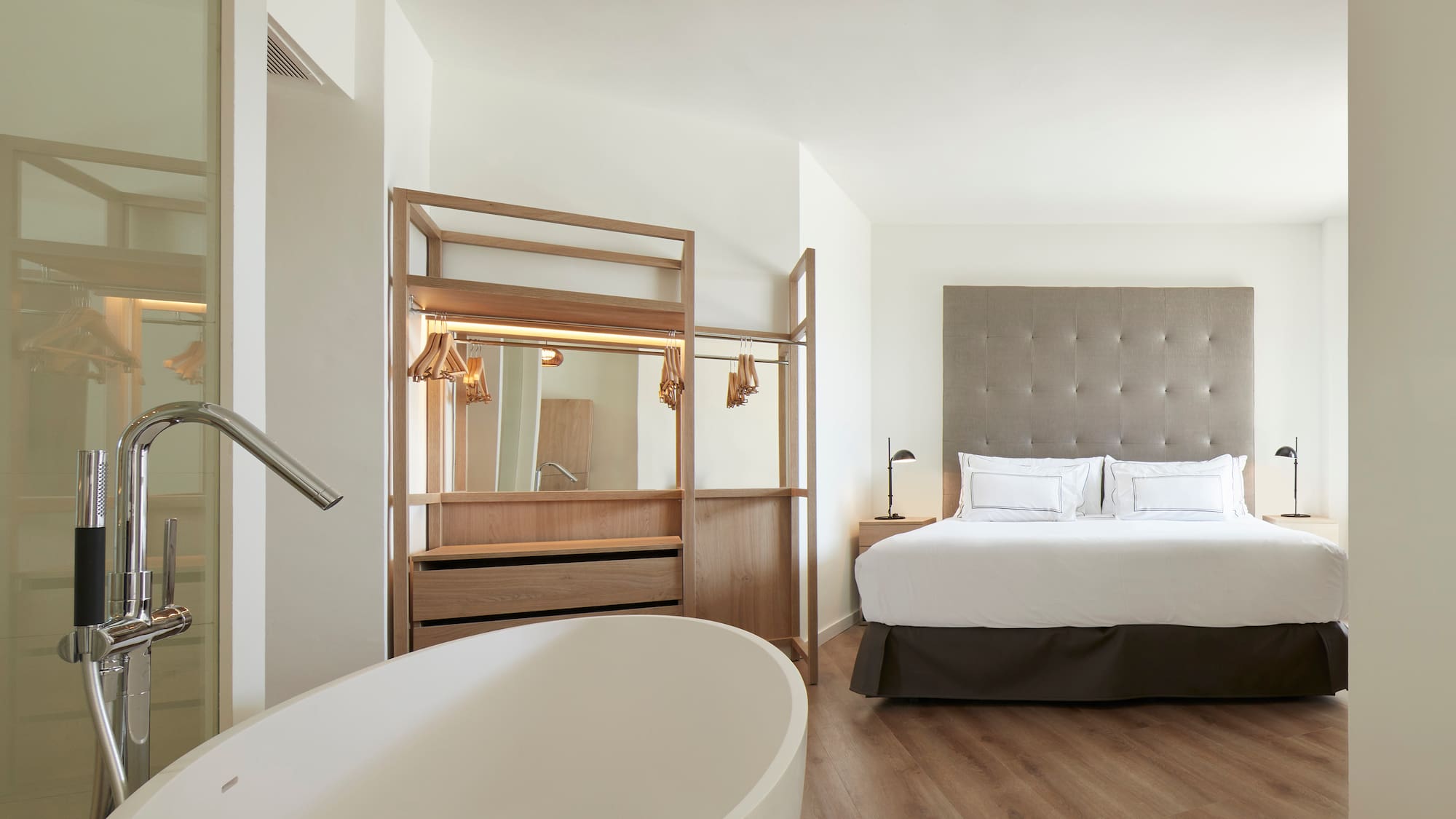 a room with a bed and a bathtub