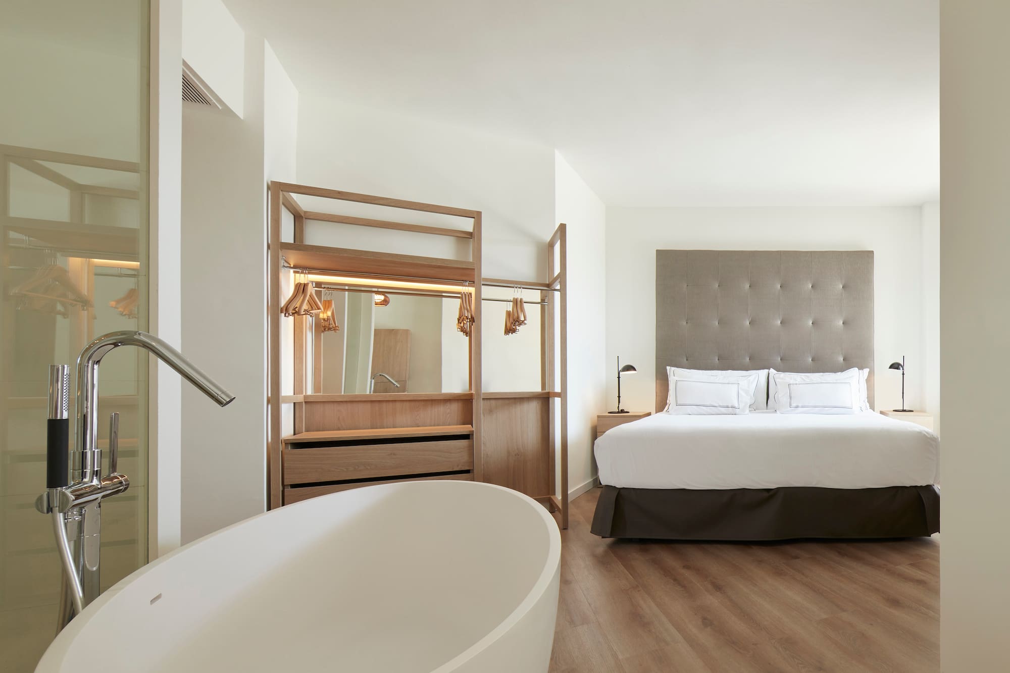 a room with a bed and a bathtub