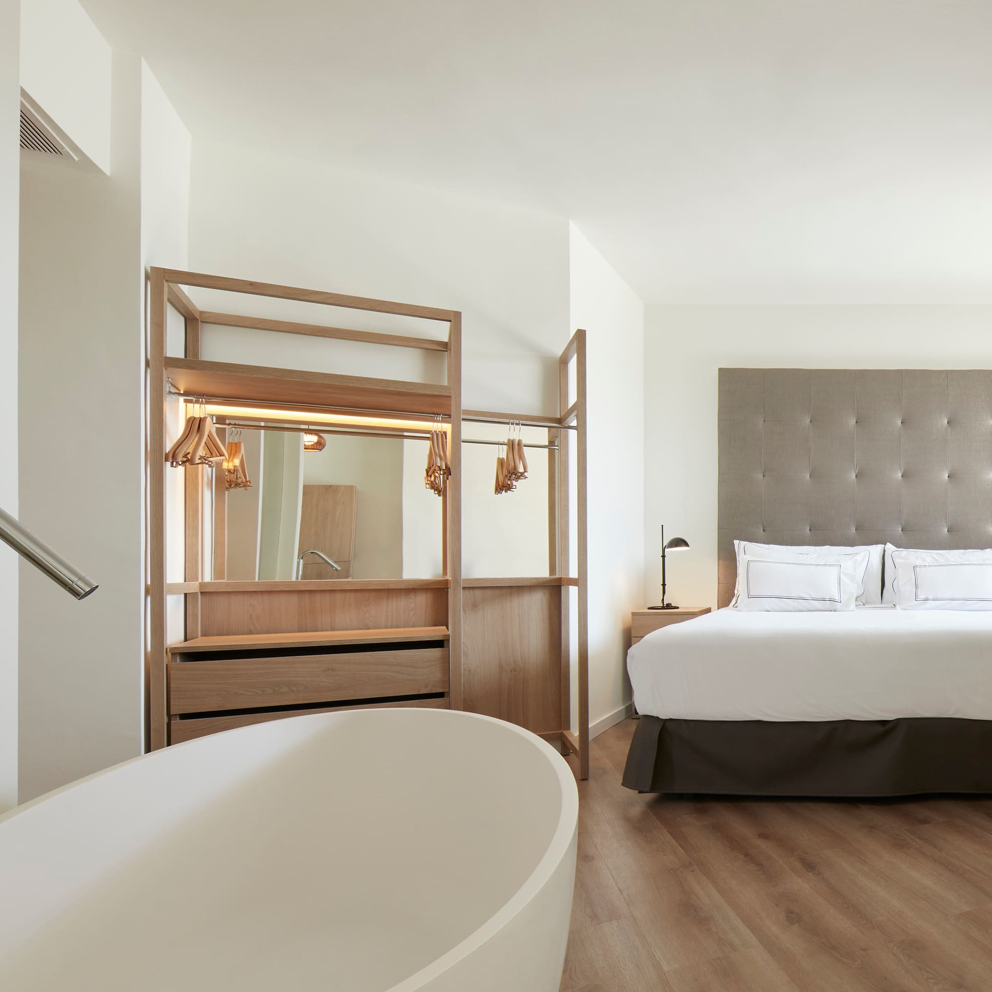 a room with a bed and a bathtub