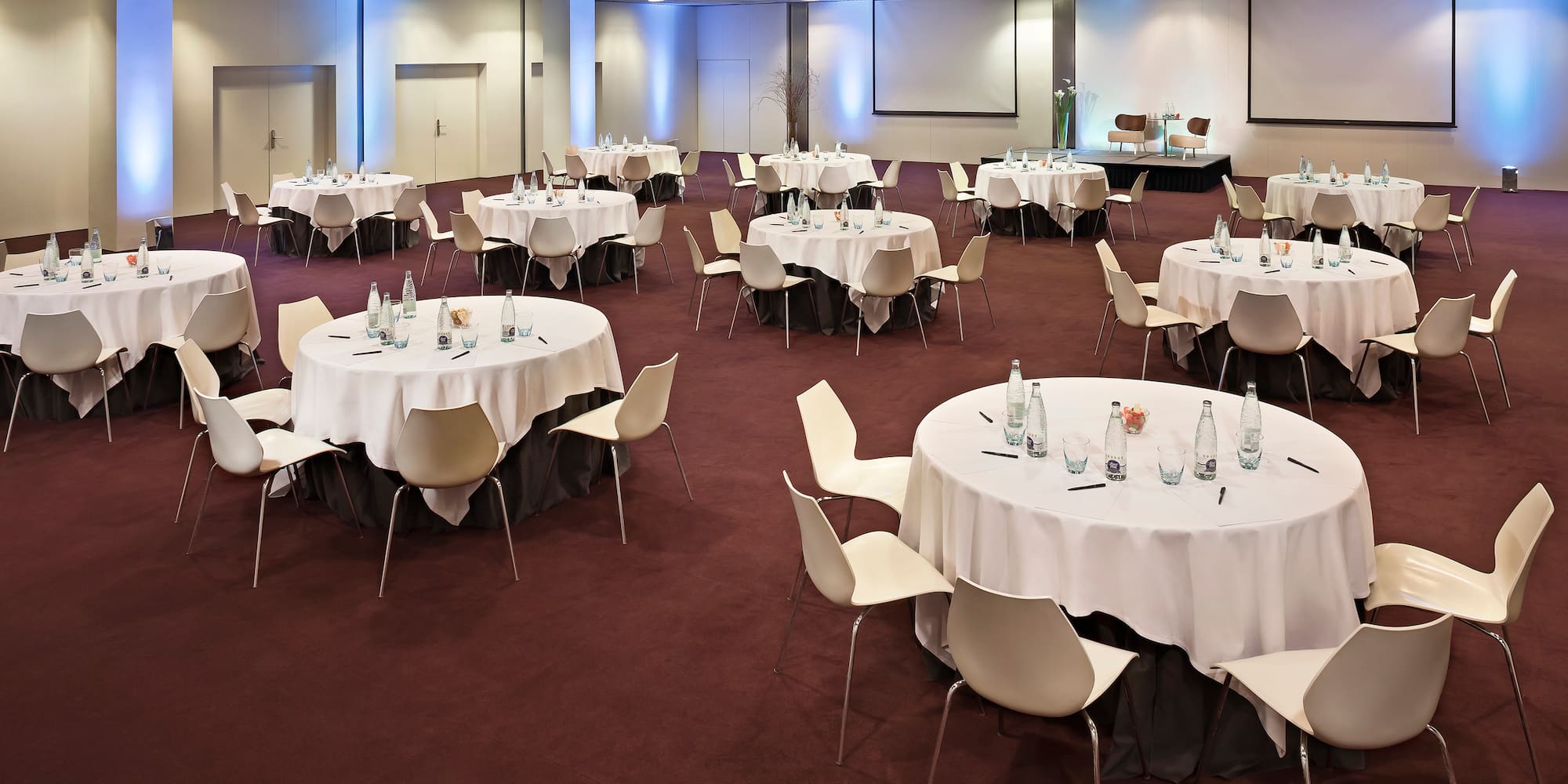 a room with tables and chairs