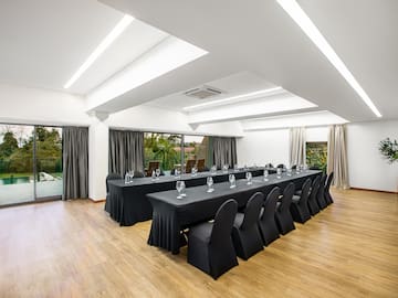 a room with long table and chairs