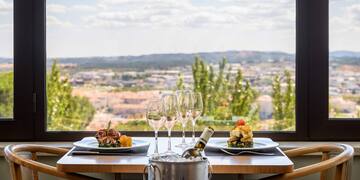 a table with food and wine glasses