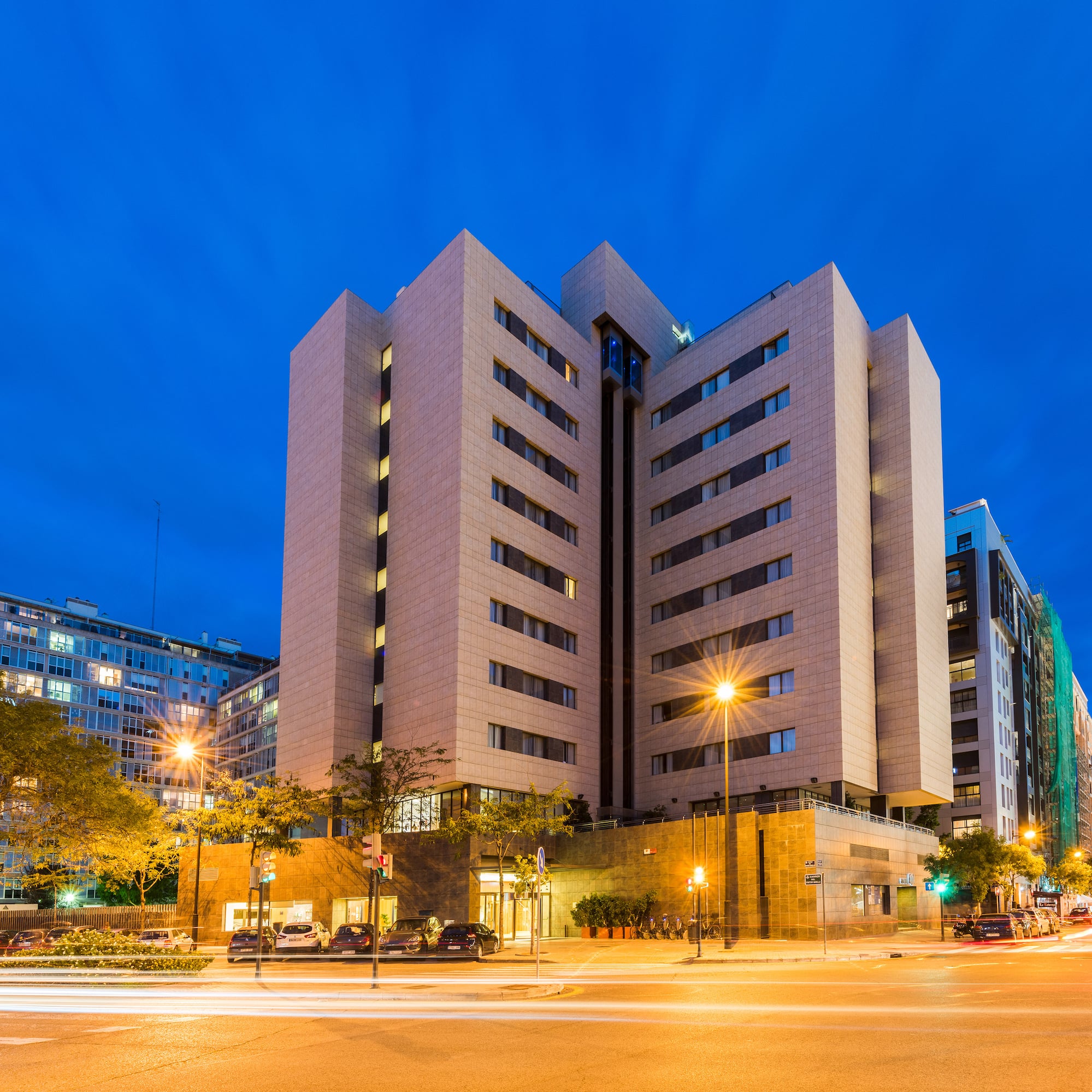 a building with many windows and a street light
