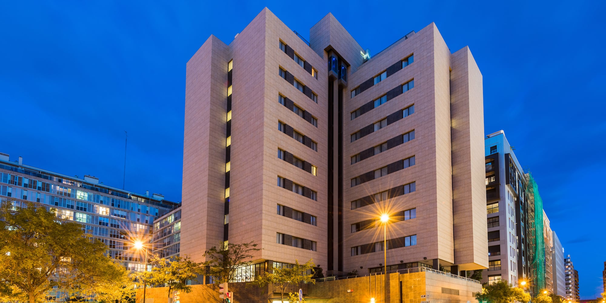 a building with many windows and a street light
