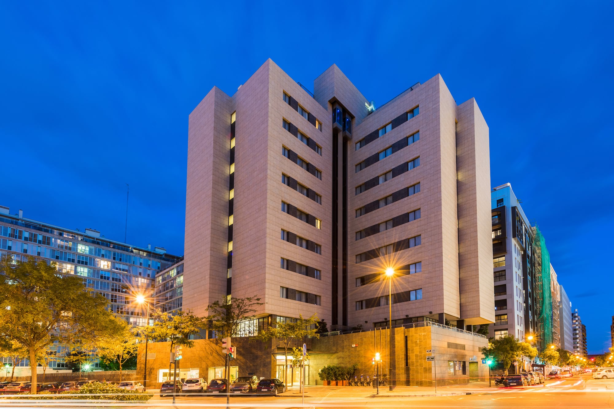 a building with many windows and a street light
