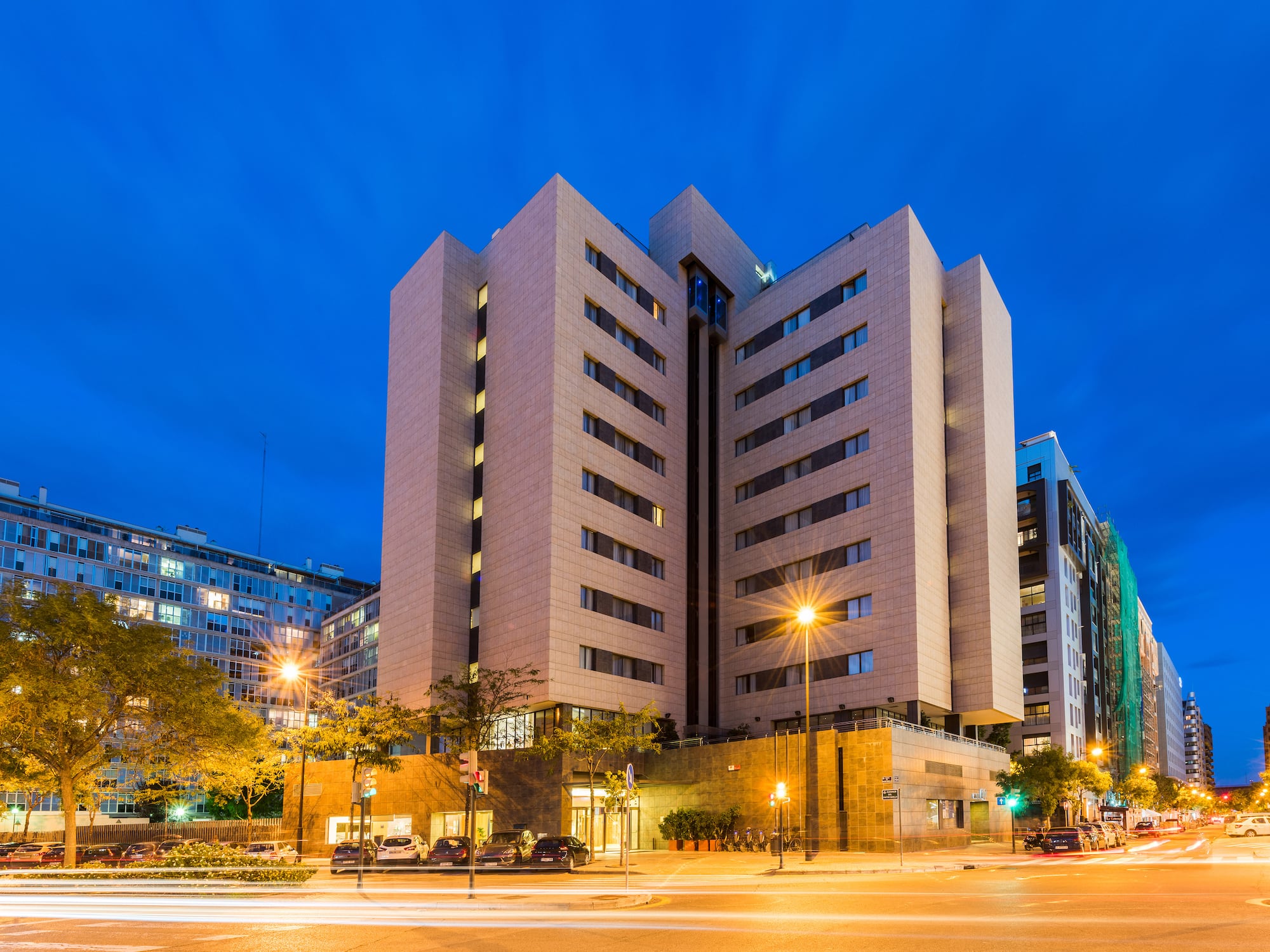 a building with many windows and a street light