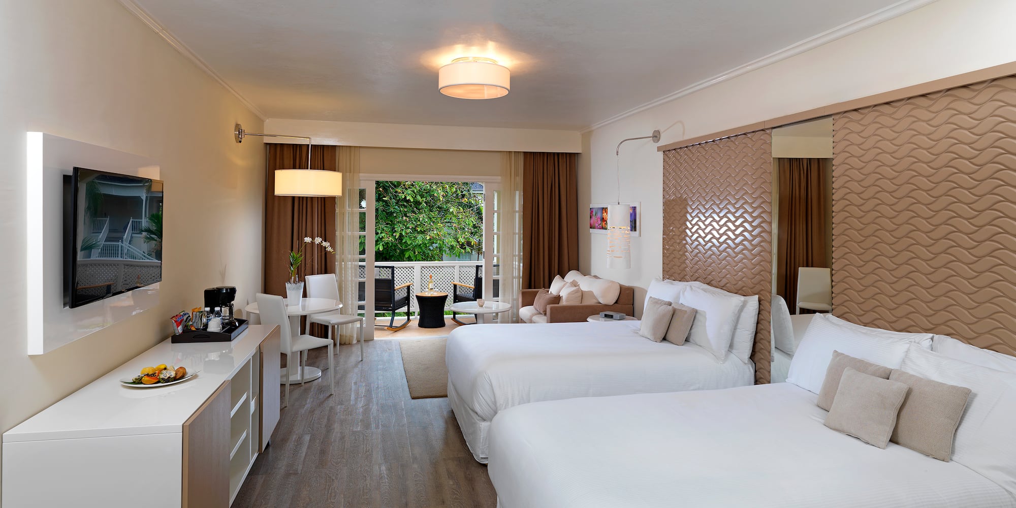 a room with two beds and a mirror