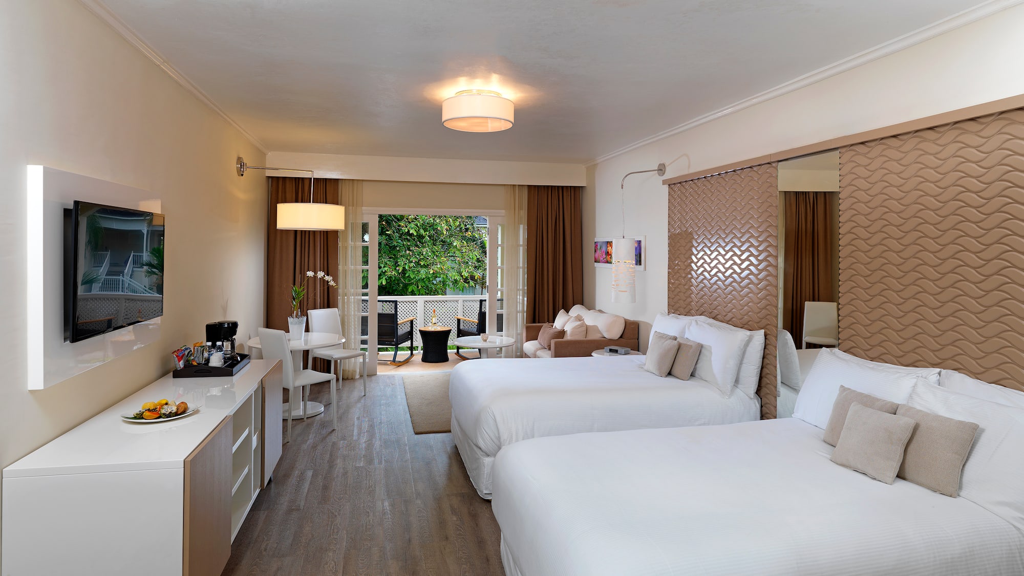 a room with two beds and a mirror