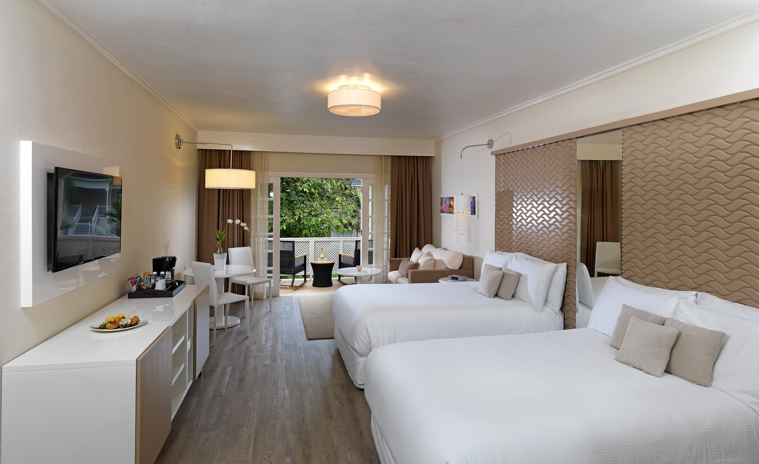 a room with two beds and a mirror