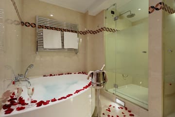 a bathroom with a tub and a shower