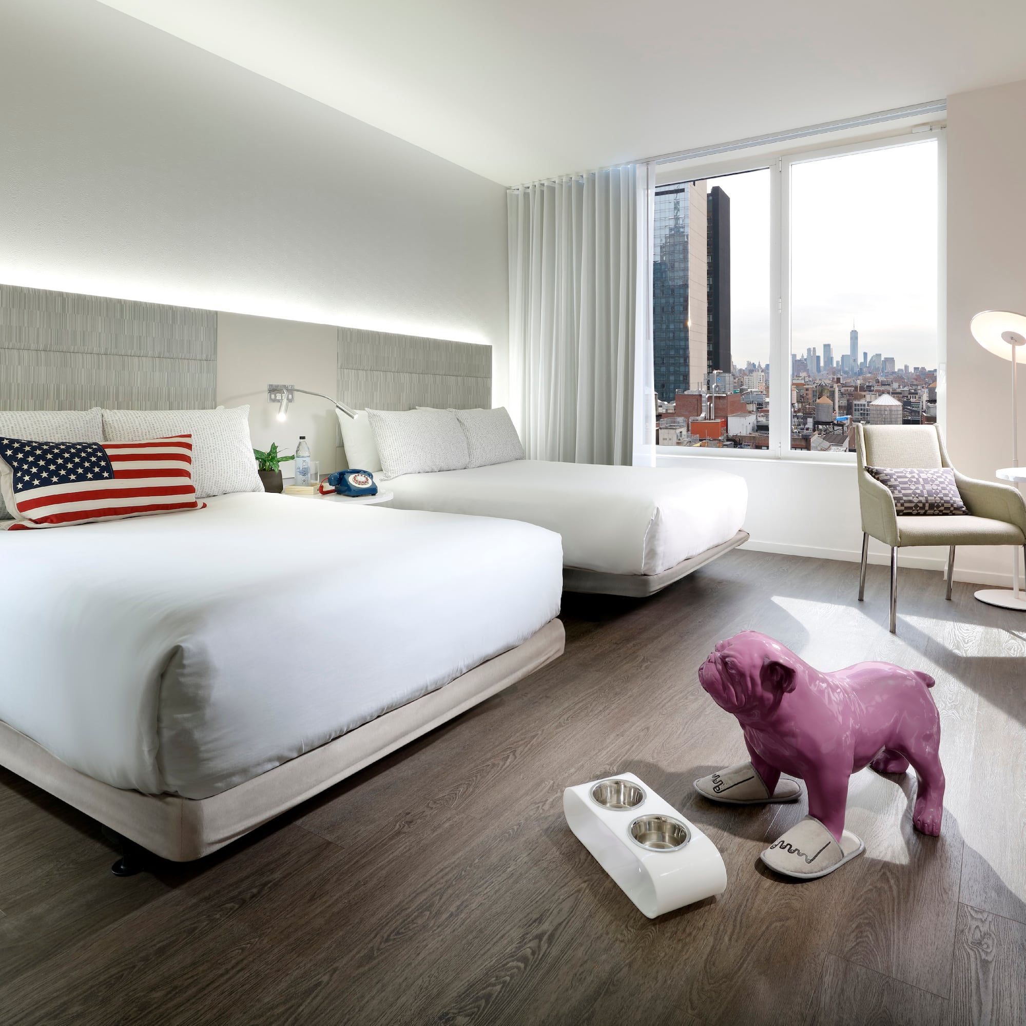 a bedroom with a dog statue and a table