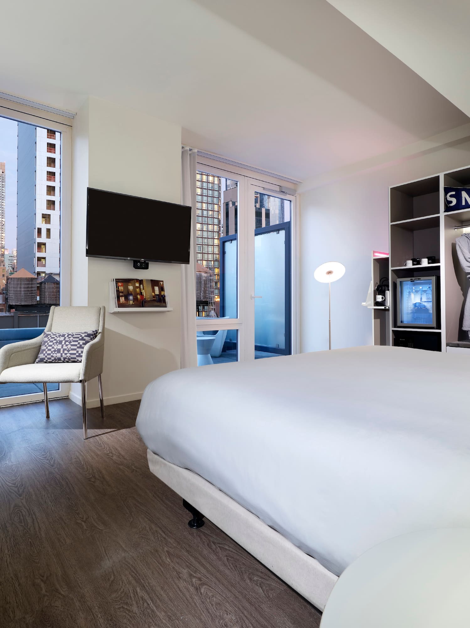 a room with a bed and a tv