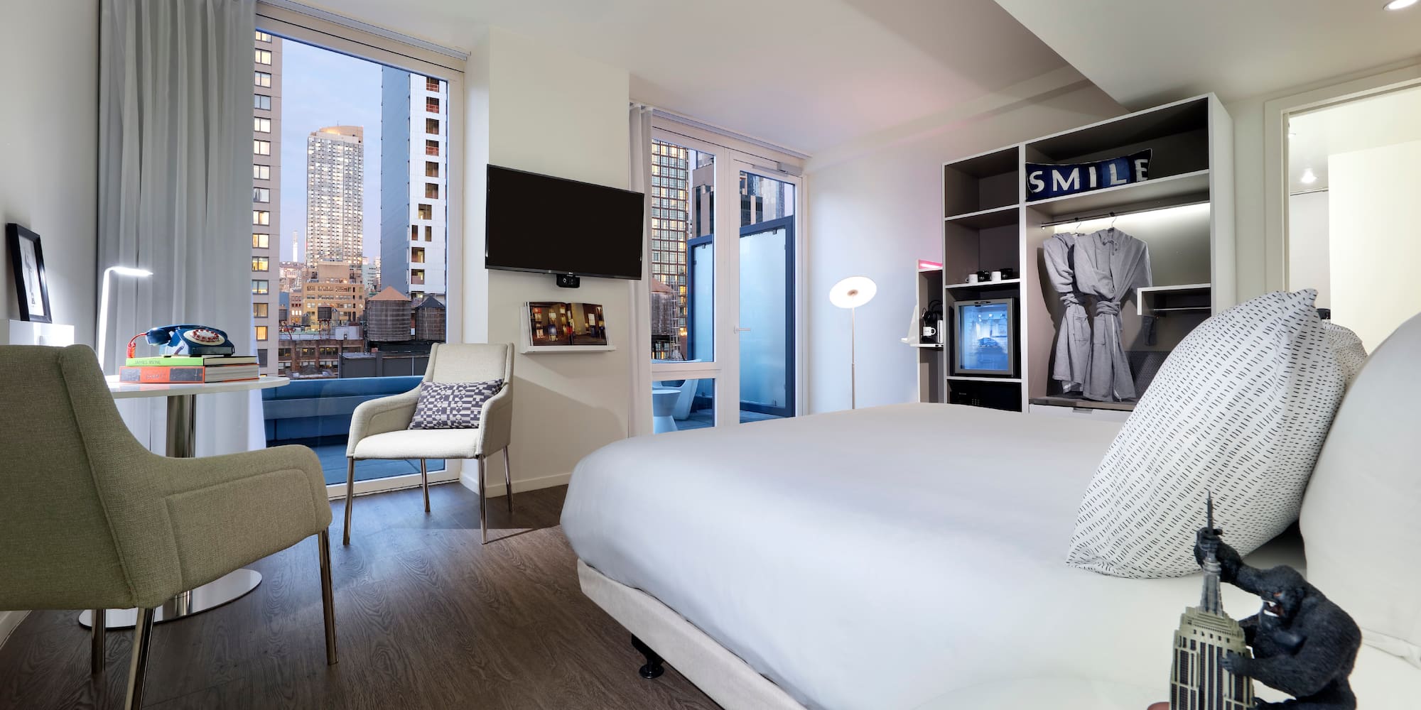 a room with a bed and a tv