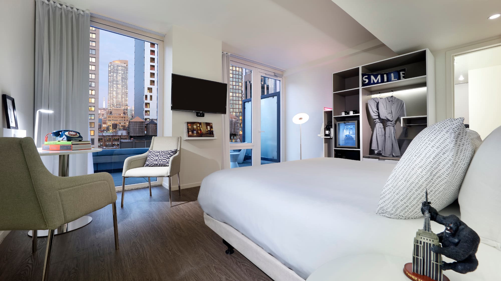 a room with a bed and a tv