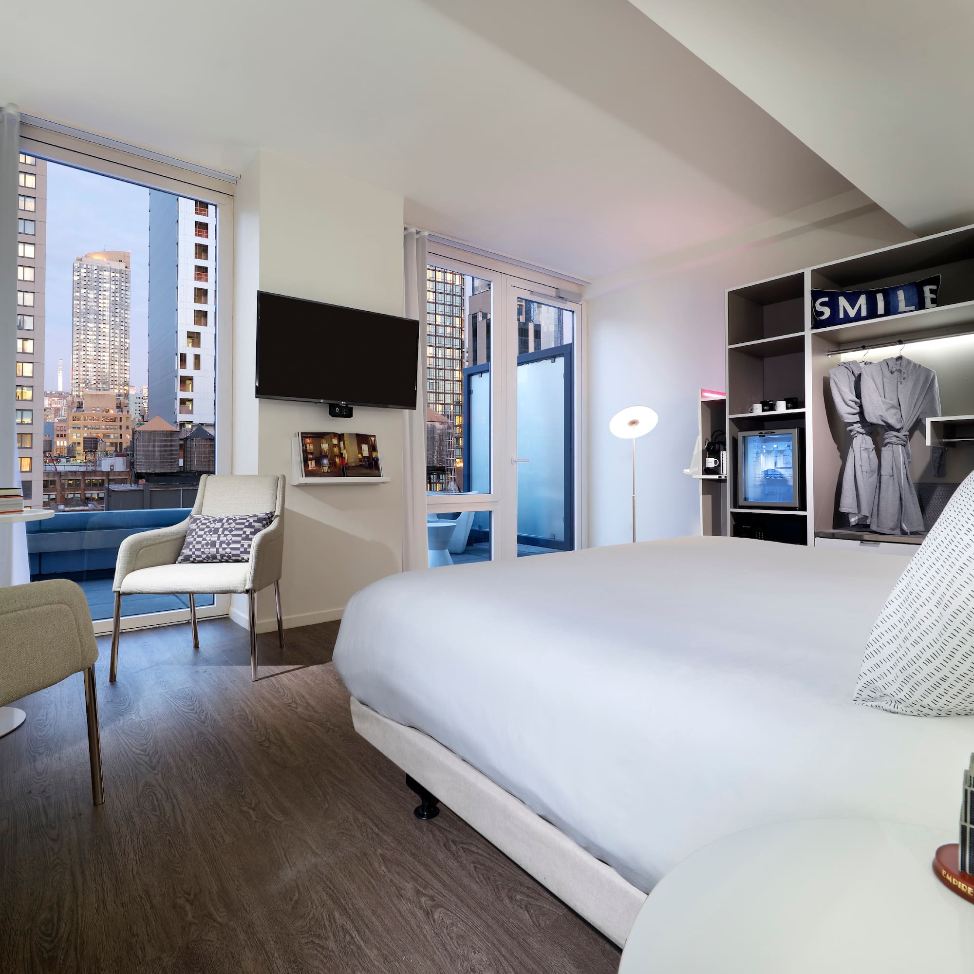 a room with a bed and a tv