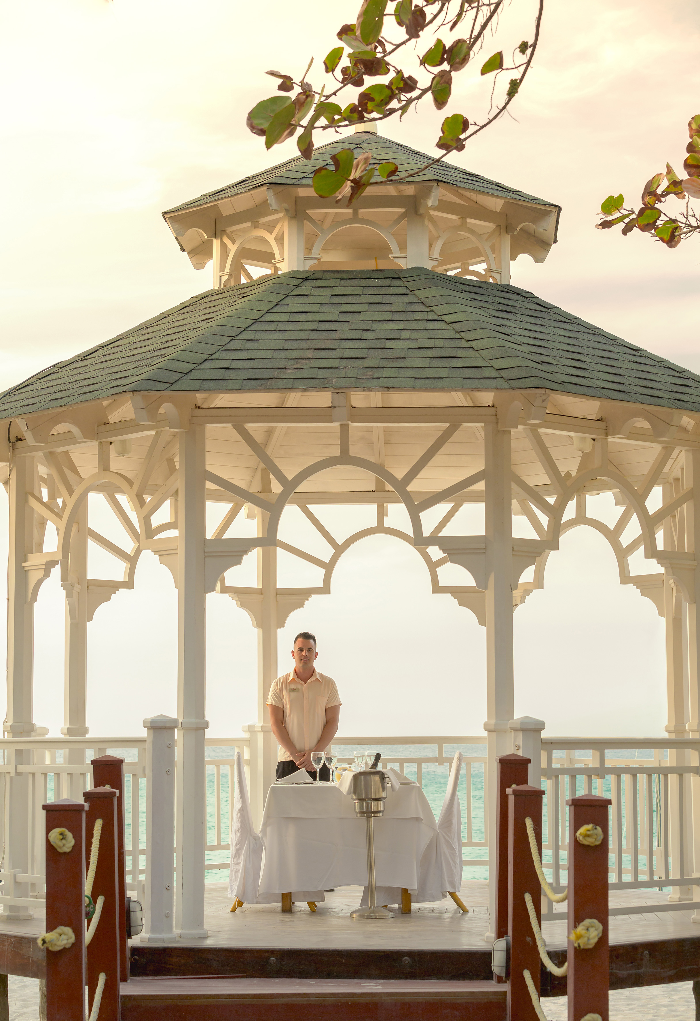 a man standing in front of a gazebo