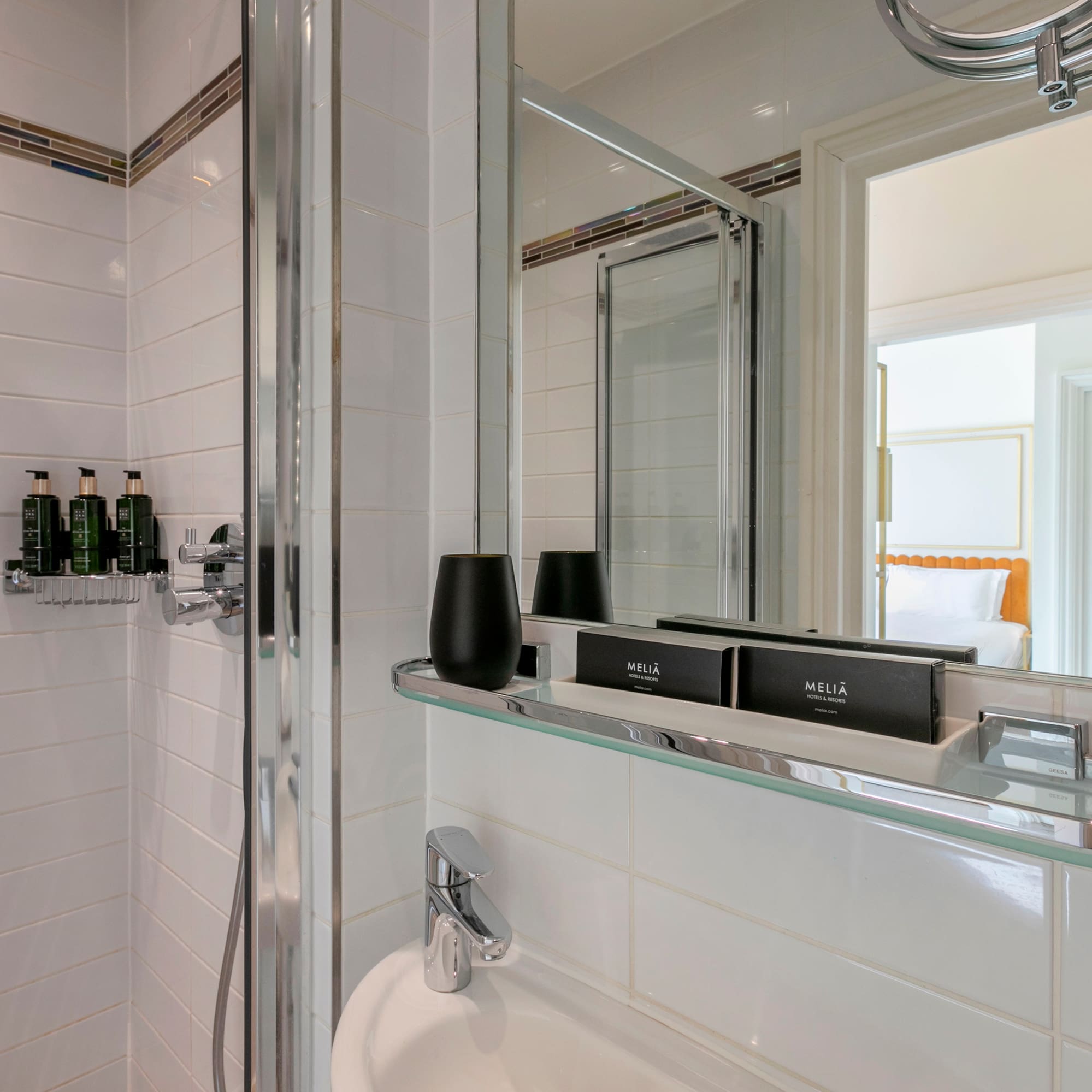 a bathroom with a glass shelf