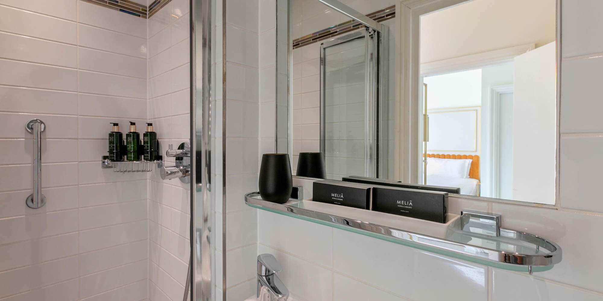 a bathroom with a glass shelf
