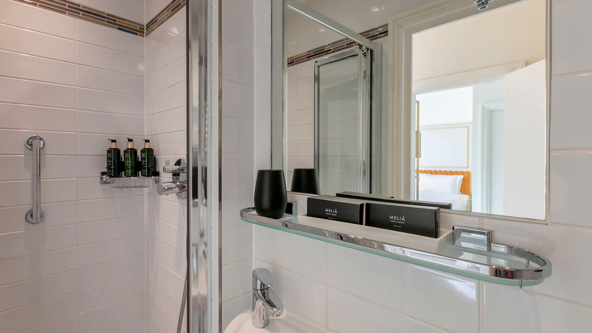 a bathroom with a glass shelf
