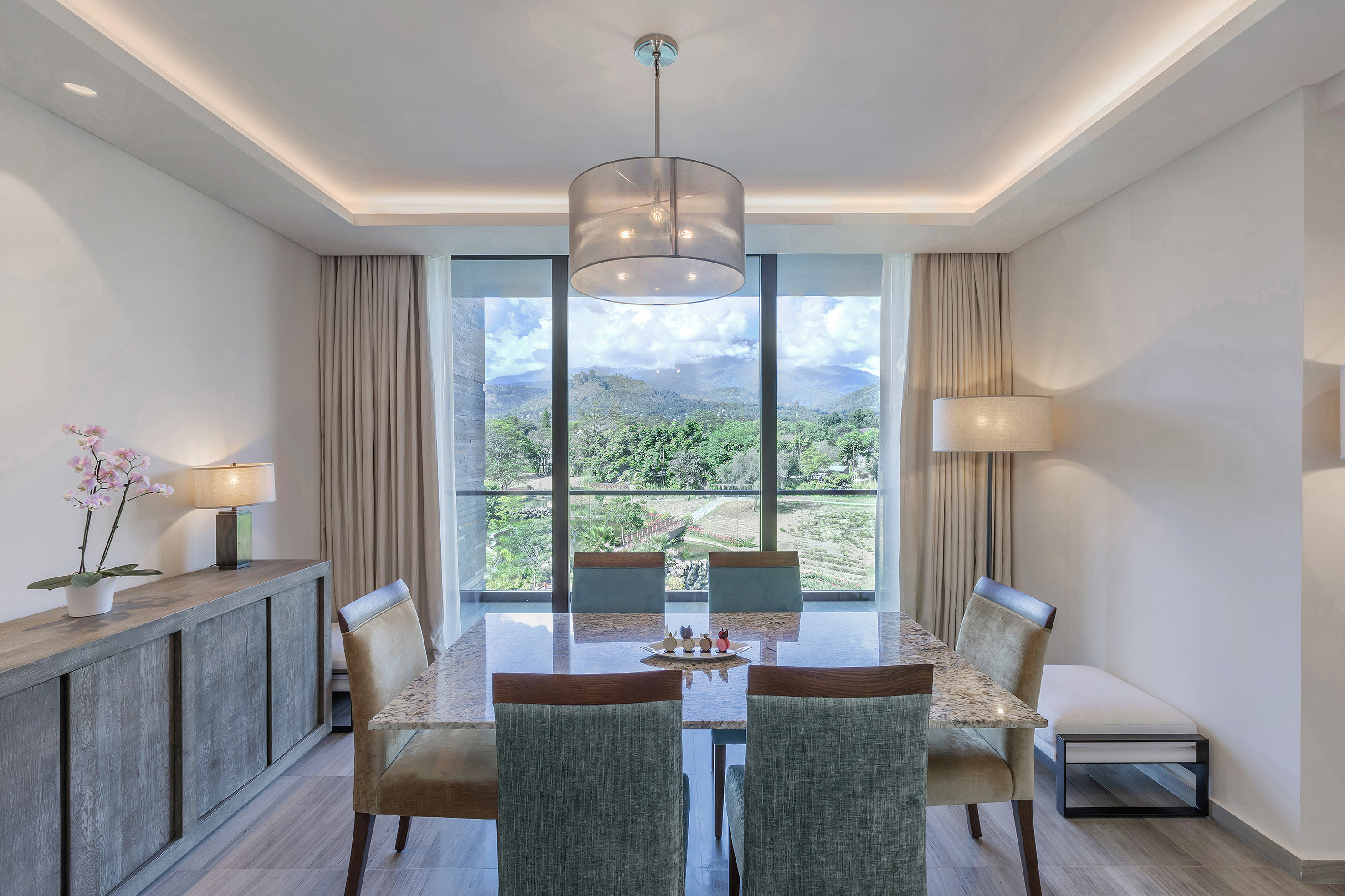 a dining room with a table and chairs