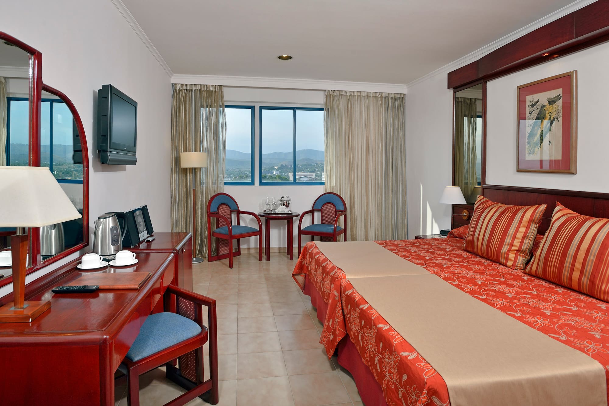 a room with a bed and a desk