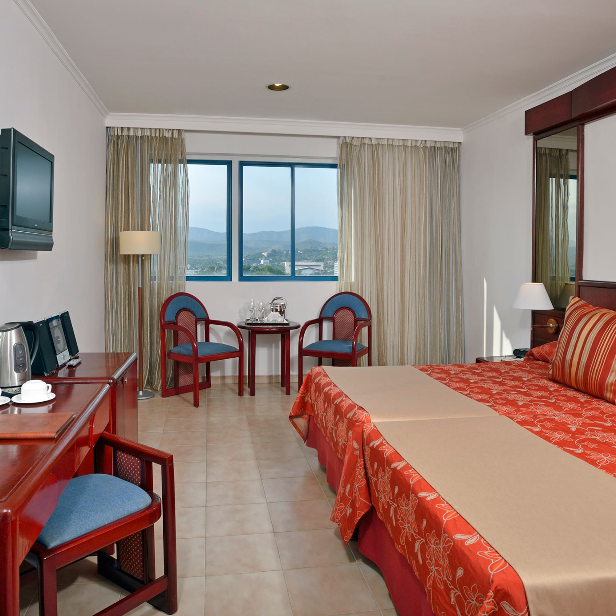 a room with a bed and a desk