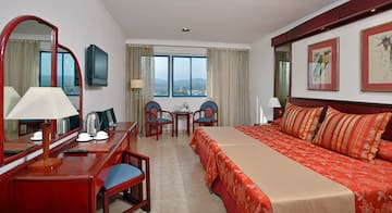 a room with a bed and a desk