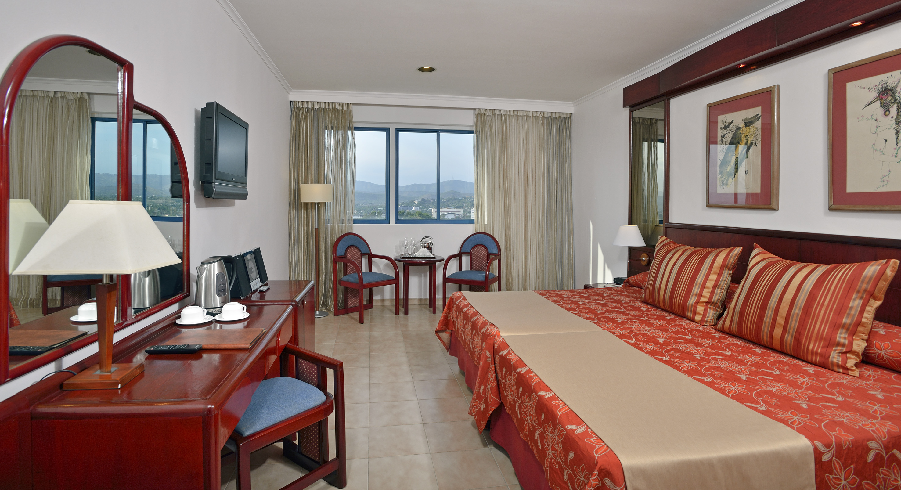 a room with a bed and a desk