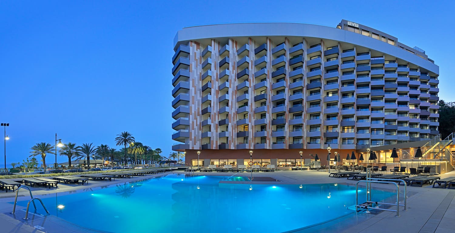 a pool and a building with a large building
