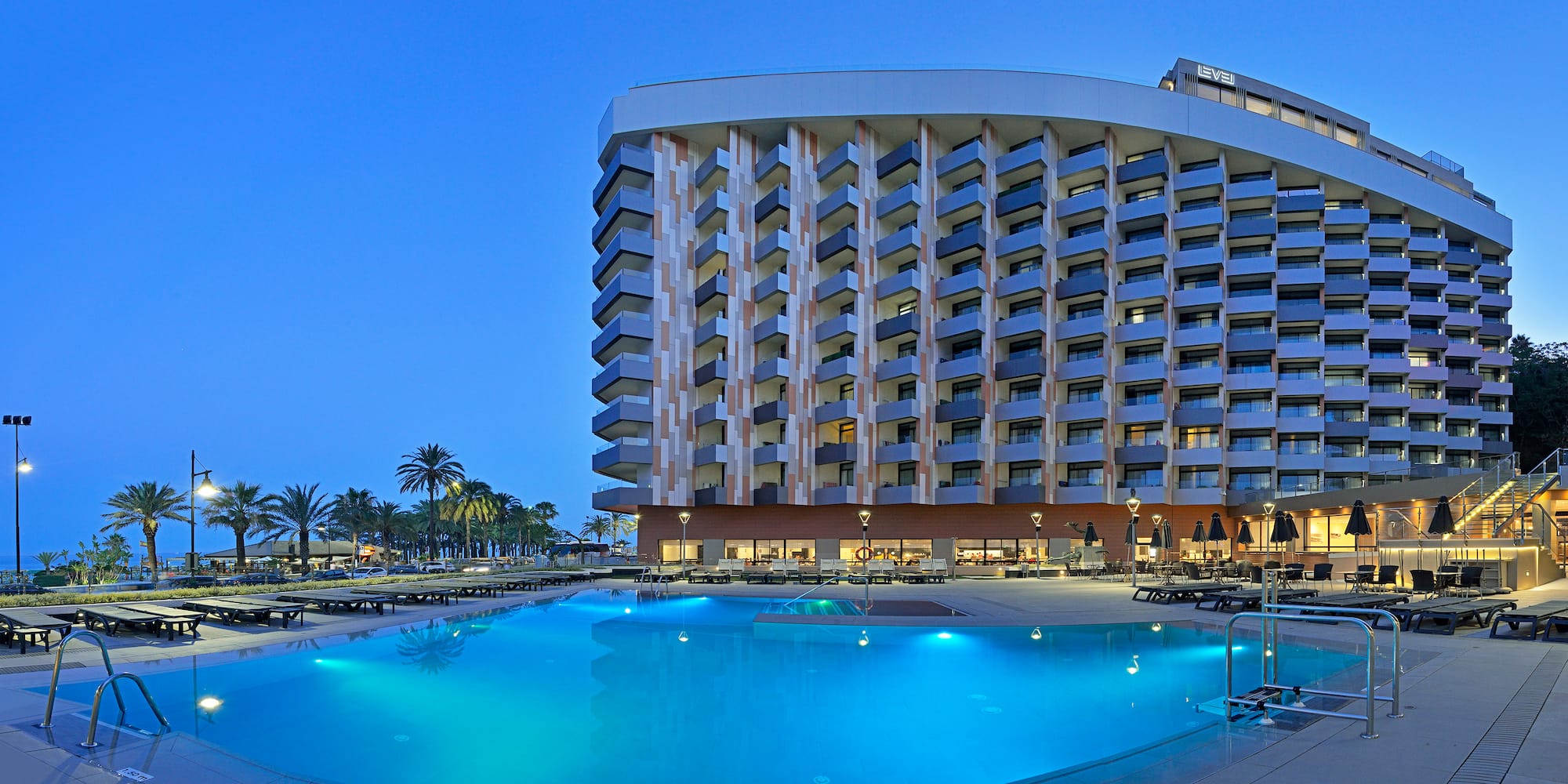 a pool and a building with a large building